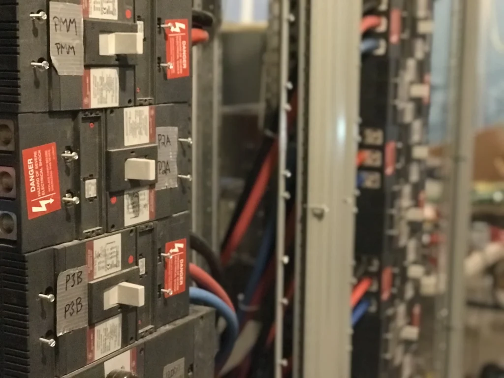 Circuit breakers and wiring inside an industrial electrical control panel